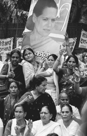 Supporters of Sonia Gandhi gather in front of her house in New Delhi, India, in 2004. AP/Wide World Photos. Reproduced by permission.