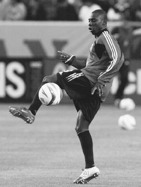 Freddy Adu warms up before a 2004 game against the Los Angeles Galaxy. AP/Wide World Photos. Reproduced by permission.