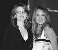 Tina Fey (left) poses with Lindsay Lohan, the star of Mean Girls. AP/Wide World Photos. Reproduced by permission.