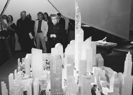 Daniel Libeskind (center) stands behind the model for his design to replace the World Trade Center. AP/Wide World Photos. Reproduced by permission.