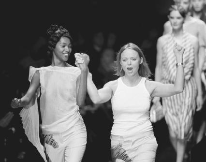 Stella McCartney (center) acknowledges applause after a Paris fashion show in 2000. AP/Wide World Photos. Reproduced by permission.