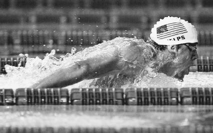 Micheal Phelps competes in the 200-meter mens' butterfly event of the 2003 FINA World Swimming Championship in Spain. AP/Wide World Photos. Reproduced by permission.