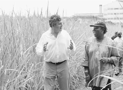 Gordon Brown, finance mini	ster of Great Britain, and Luisa Diogo visit a sugar plant near Maputo, Mozambique, in early 2005. Britain agreed to pay 150 million of Mozambiques debt to the World Bank over the next ten years.  Juda Ngwenya/Reuters