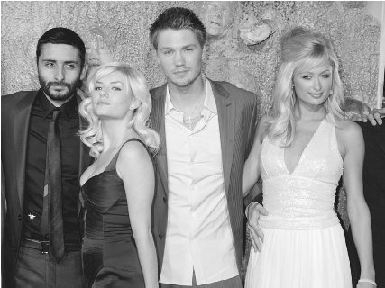Chad Michael Murray, Elisha Cuthbert, and Paris Hilton (right) pose with director Jaume Collet-Serra (far left) at the premiere of their 2005 film House of Wax.  Fred Prouser/Reuters/Corbis.