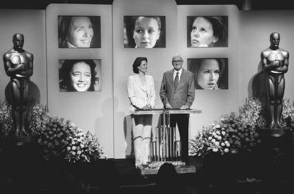 Actress Sigourney Weaver and Academy president Frank Pierson announce the nominees for the 2004 best leading actress Oscar. Pictured on the screen behind them, from lower left: Keisha Castle-Hughes, Diane Keaton, Samantha Morton, Charlize Thero
