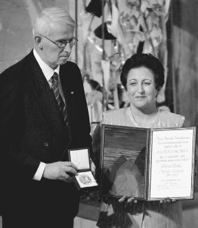 Shirin Ebadi (right) receives the Nobel Peace Prize, December 10, 2003. Ebadi holds the Nobel Diploma and Ole Danbolt Mjos, chairman of the Norwegian Nobel Committee, holds the medal which goes along with the prize. AP/Wide World Photos. Reprod