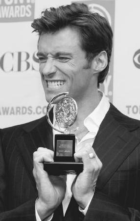 Hugh Jackman poses with his 2004 Tony Award. AP/Wide World Photos. Reproduced by permission.