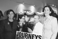 Nancy Pelosi (left) and her daughter Alexandra Pelosi, pose with a poster for Alexandras documentary, Journeys with George. Arun Nevader/WireImage.com.