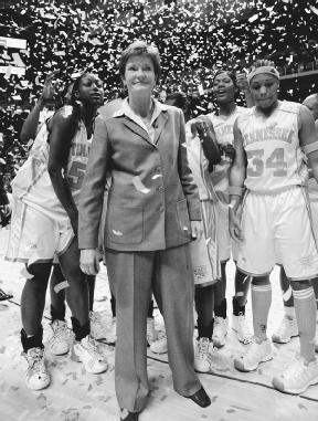 Pat Summitt (center), with the Tennessee Lady Vols after her 800th career win, January 14, 2003. AP/Wide World Photos. Reproduced by permission.